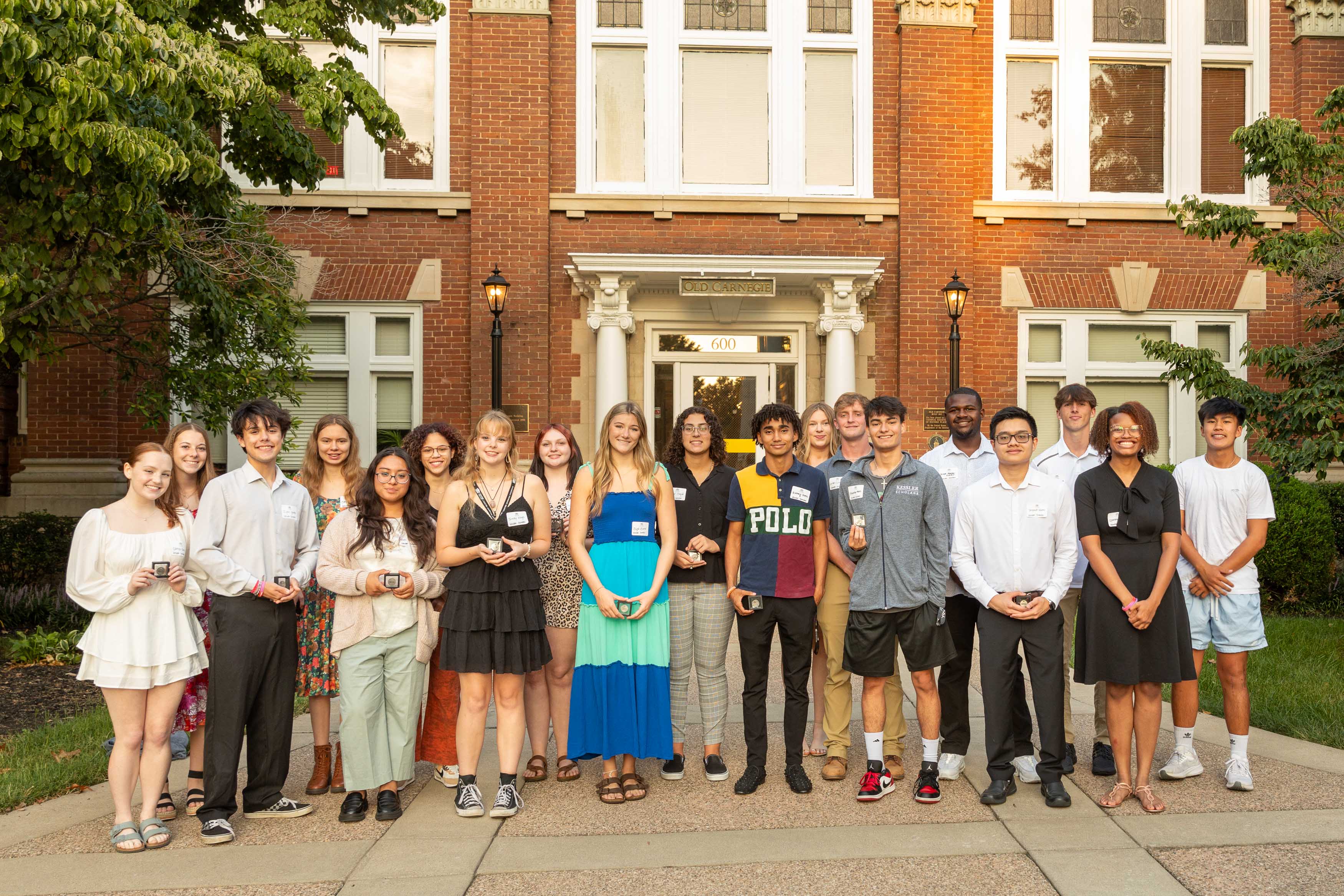 A group of first generation students stand outside of Centre College's campus.