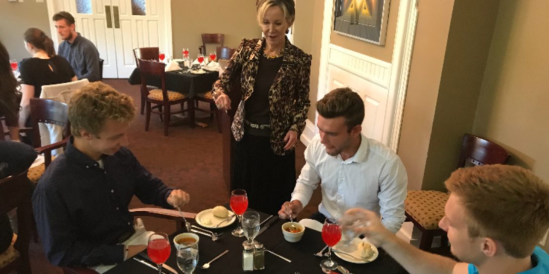 Jahnae Barnett talks to students at an etiquette dinner she hosted. / Courtesy of William Woods University